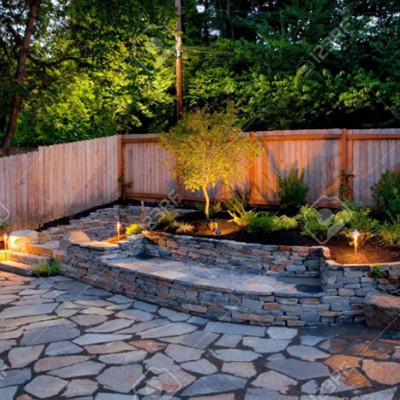 Hardscaping with bench and patio, designed and built by Bacon Property Services.