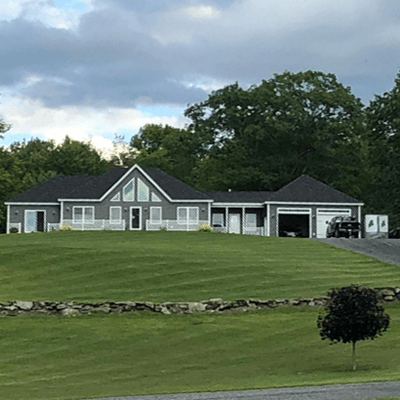 Image of home after mowing and lawncare was completed by Bacon Property Services.