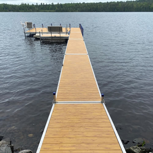 Wooden dock installed by Bacon Property Services.
